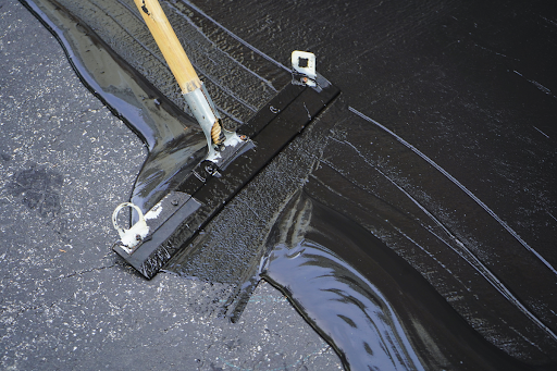 What’s the Difference Between Asphalt Paving & Sealcoating?